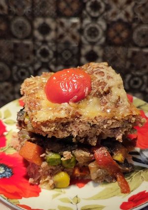 М'ясна запіканка з телятини з овочами, молоком та кускусом