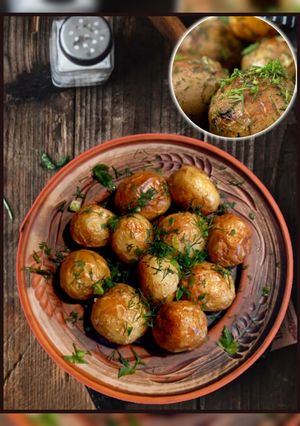 Молода картопля зі скоринкою, з часником, зеленню та паприкою запечена в духовці